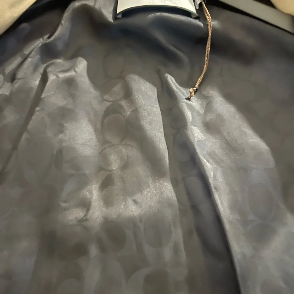 I am listing a men’s Coach trench coat size large - Picture 8 of 10